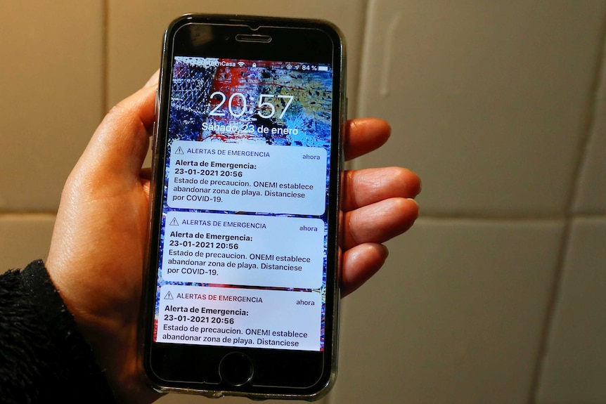 A mobile is seen with tsunami warning messages sent by mistake