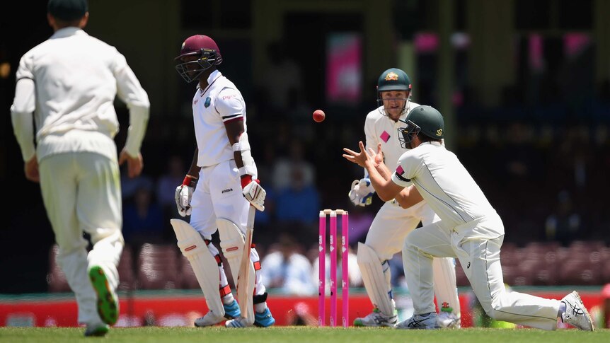 On the spot ... Joe Burn catches Kemar Roach off the bowling of Nathan Lyon