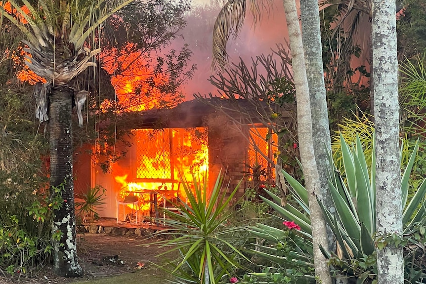 a house engulfed in flames