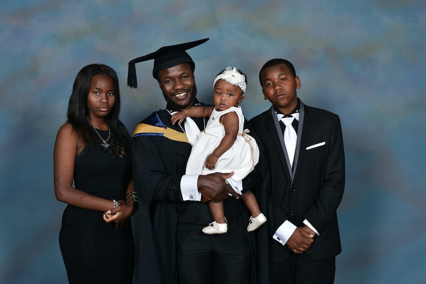 a family posing for a graduation photo