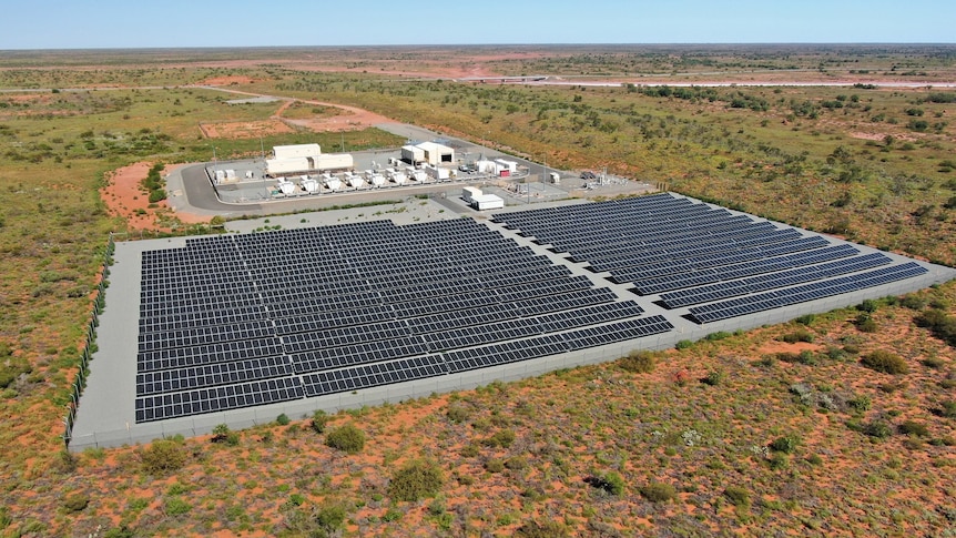 Drone shot of solar farm and gas-fired power station in the red dirt of Onslow