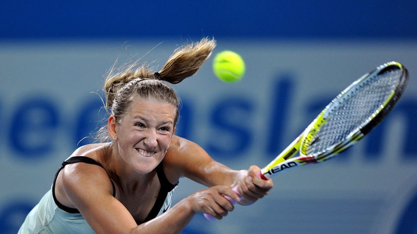 Azarenka returns a shot to Bartoli