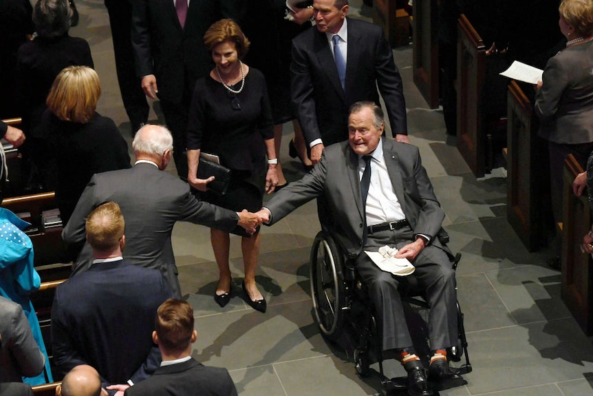 Bush Snr greeted in church at funeral
