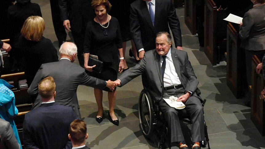 Bush Snr greeted in church at funeral