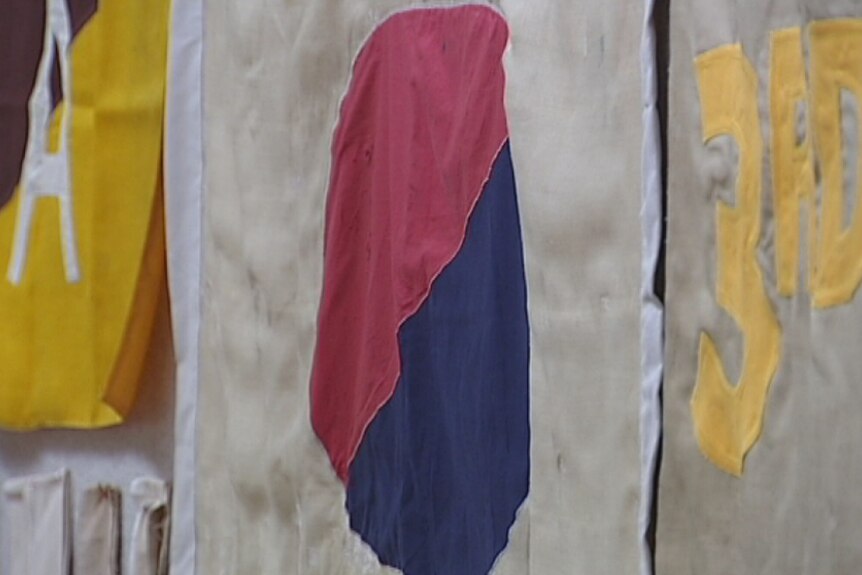 Close up of a World War One banner restored and returned to the Victorian RSL