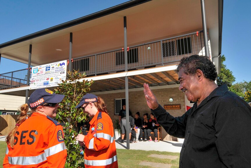Tau Taufa farewells SES volunteers at the opening of the rebuilt home.
