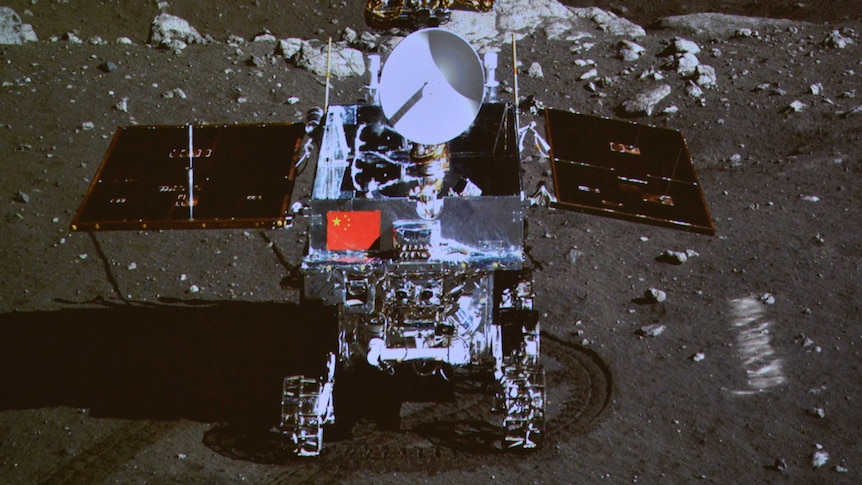 A photograph of the giant screen at the Beijing Aerospace Control Centre shows photo of the Yutu, or Jade Rabbit, lunar rover