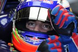 Daniel Ricciardo of Australia pulls on his gloves