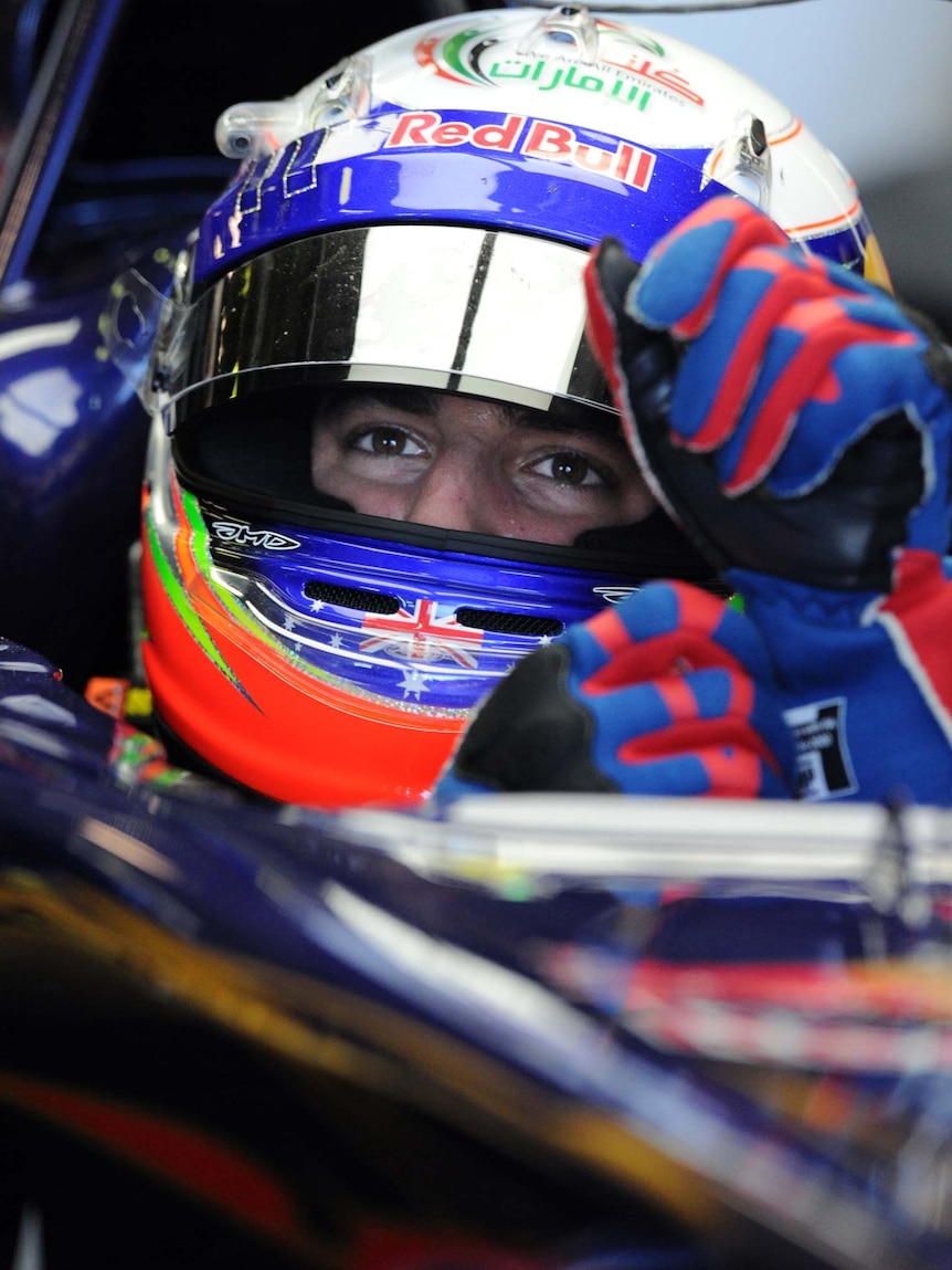 Daniel Ricciardo of Australia pulls on his gloves