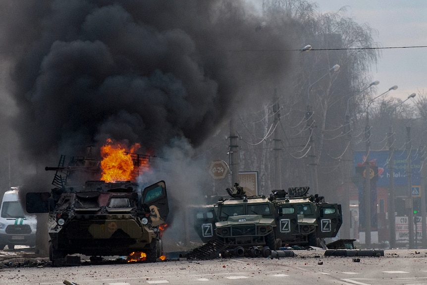 A Russian armoured personnel carrier in flames on the streets of Kharkiv, Ukraine.