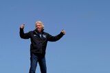 Sir Richard Branson stands on top of the Virgin Oceanic, a solo piloted submarine