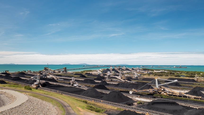 Aerial photo of Port of Hay Point, huge piles of coal are loaded and transported to ships, November 2021.