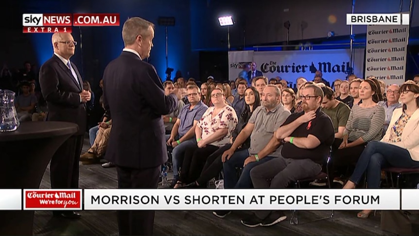 The two men in front of the crowd.