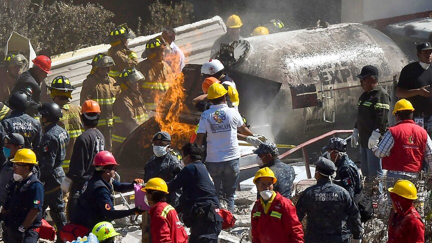 Rescue workers go into action at site of gas blast in Mexico