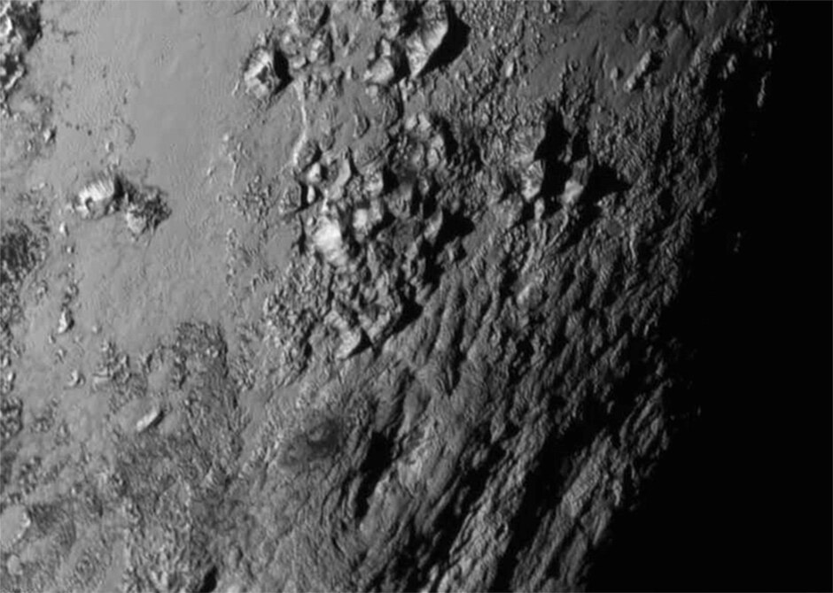 A close-up captured by New Horizons during its closest pass by Pluto reveals a range of mountains as high as 3,500 metres.