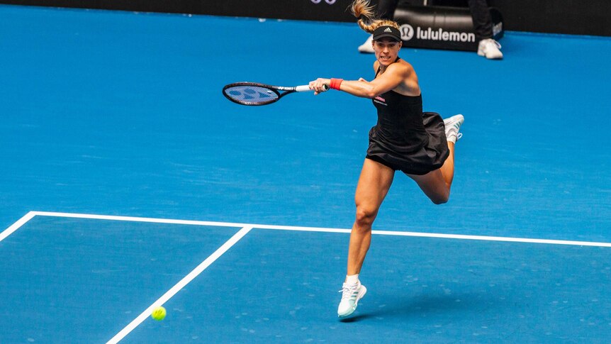 Angelique Kerber of Germany hits a forehand return at the 2019 Hopman Cup against France.