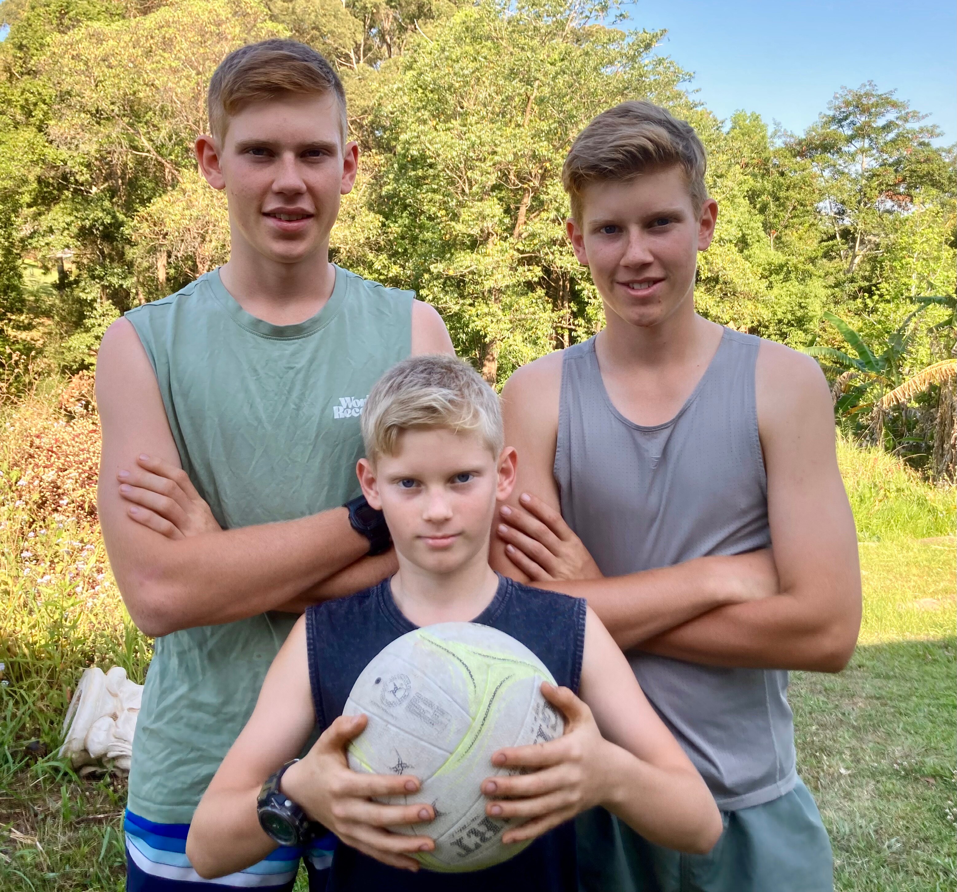 Brothers Joseph 16,  Harrison 9 Benamin 15 smile for a photo.