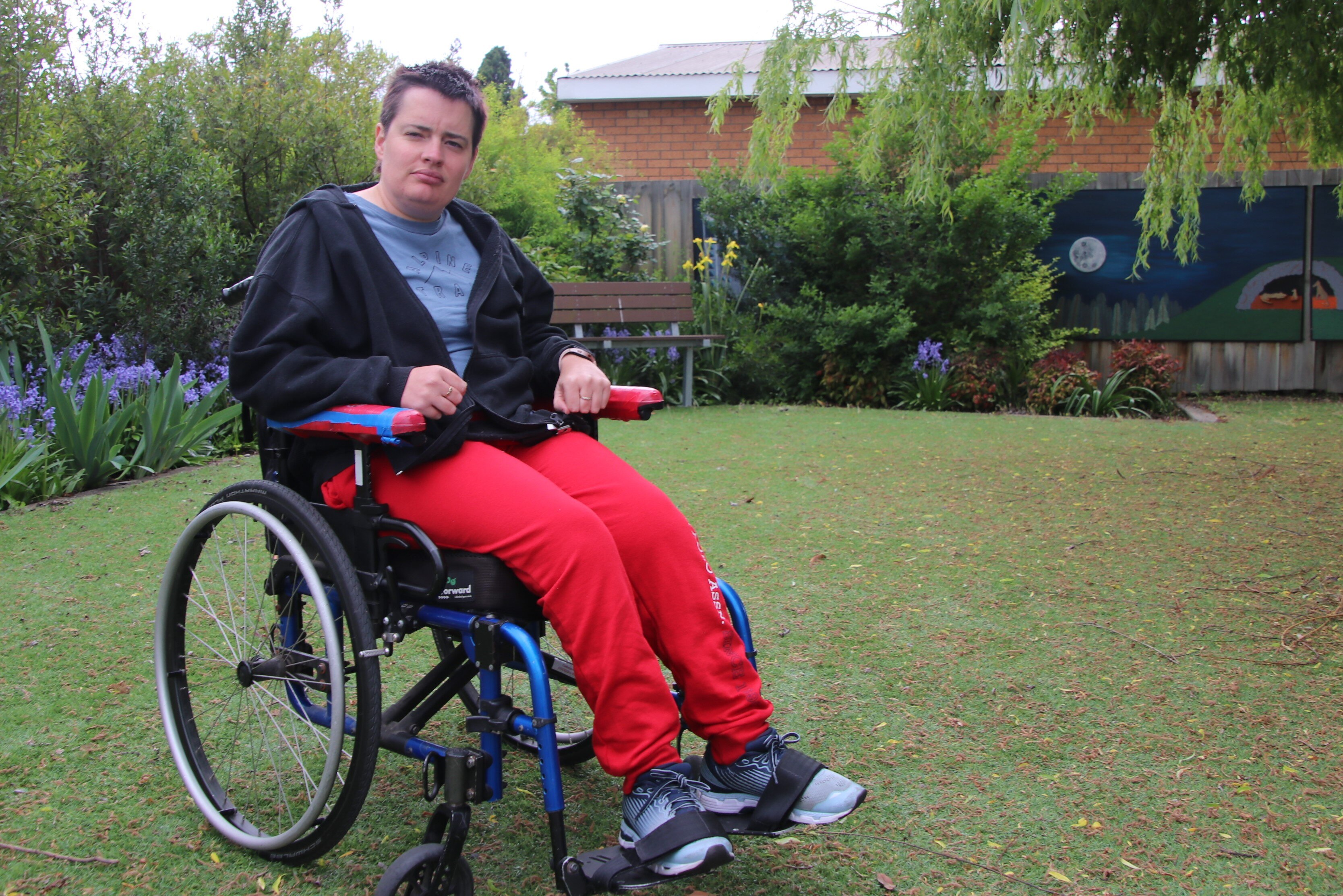 This 35-year-old longs to be out with her friends. But a lack of accessible taxis has stranded her at home