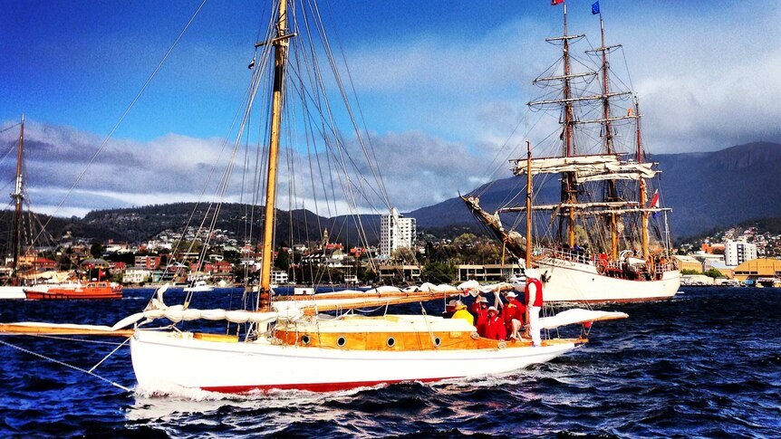 Tall ships make their way out of Hobart's River Derwent after a five-day festival.