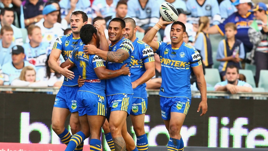 Try time ... Eels centre Ryan Morgan celebrates his try with team-mates.