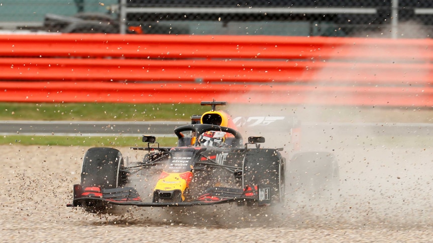 Max Verstappen's car goes spinning as gravel goes flying at Silverstone