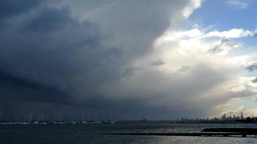 A storm front moves across Port Phillip Bay and Melbourne.