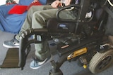 Wheelchair with unidentified adolescent