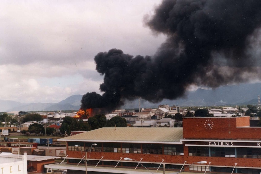 column of black smoke from fire.