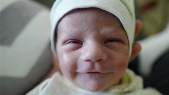 Jimmy Kimmel's baby Billy smiles at the camera.