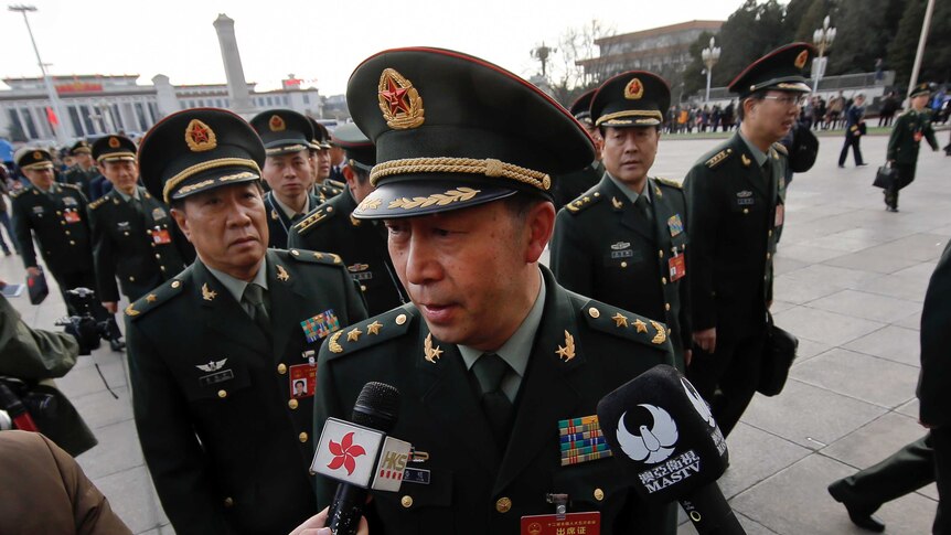 Representatives from China's People's Liberation Army heading into Beijing's Great Hall of the People.