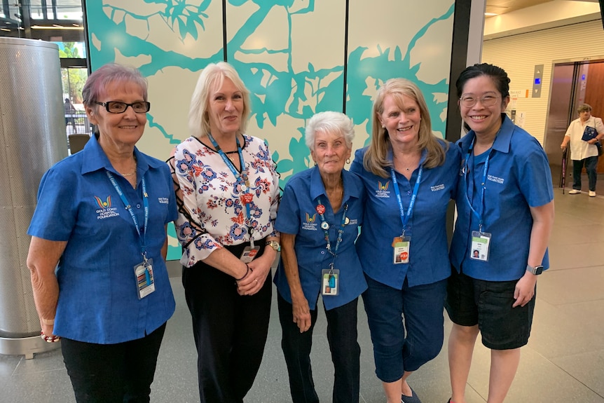 Four Gold Coast Health standing with their supervisor.