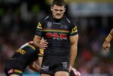 Nathan Cleary holds his left hamstring and grimaces