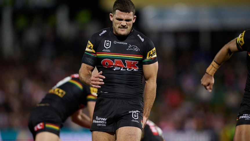 Nathan Cleary holds his left hamstring and grimaces