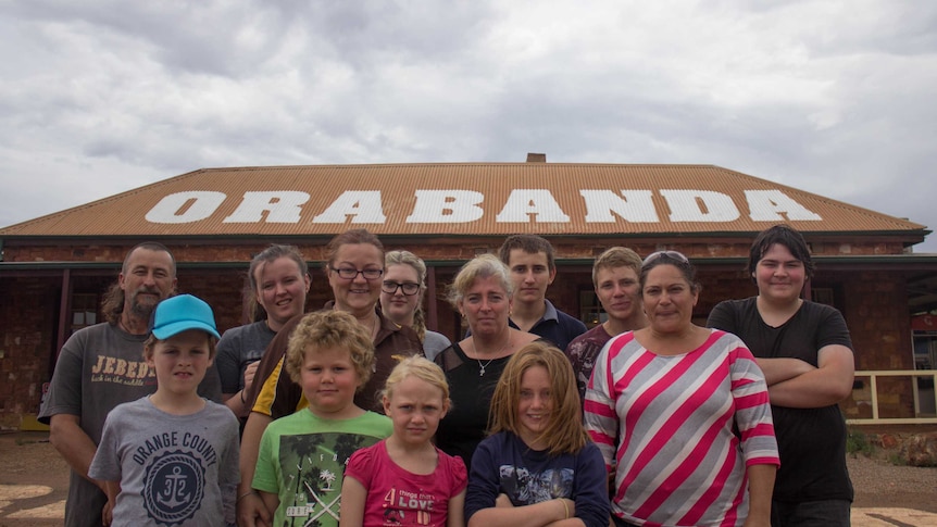 Ora Banda locals stand outside the town's historic Tavern.