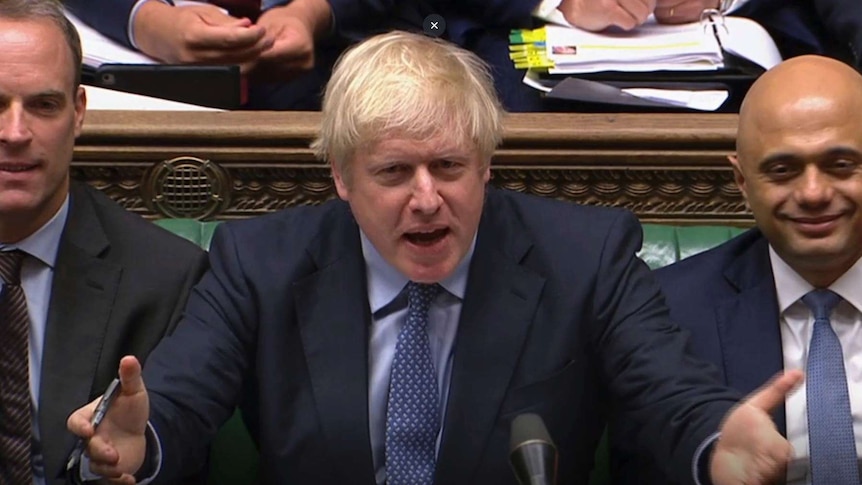 Boris Johnson gestures in Parliament.