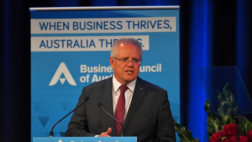 Prime Minister Scott Morrison stands at a lectern with 'Business Council of Australia' signage