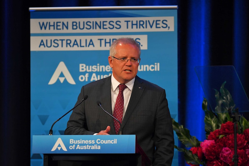 Prime Minister Scott Morrison stands at a lectern with 'Business Council of Australia' signage