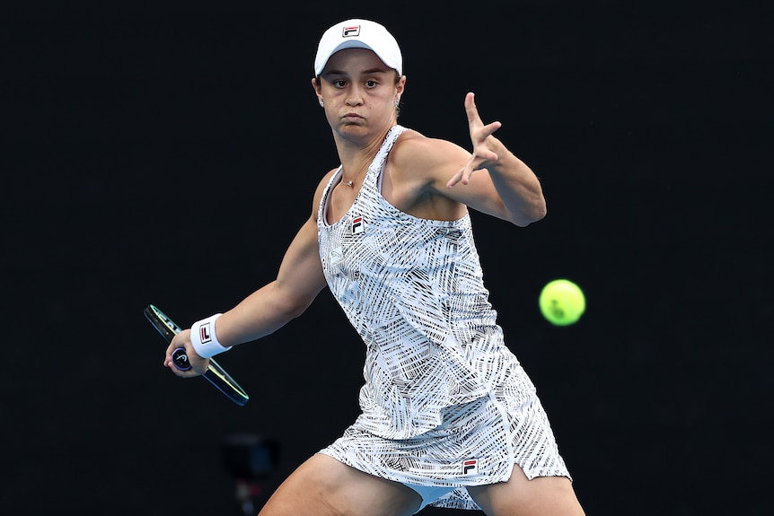 An Australian female tennis player prepares to play a forehand return.