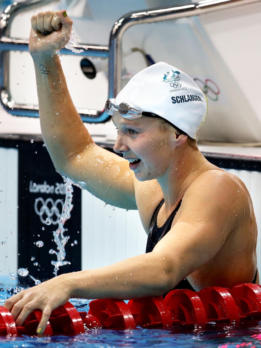 Melanie Schlanger acknowledges the crowd after winning her semi-final of the 100m freestyle.
