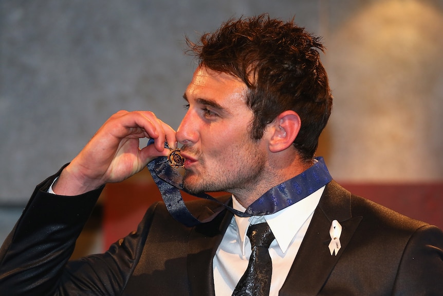 Jobe Watson held off the field to win with 30 votes after a brilliant season for the Bombers.