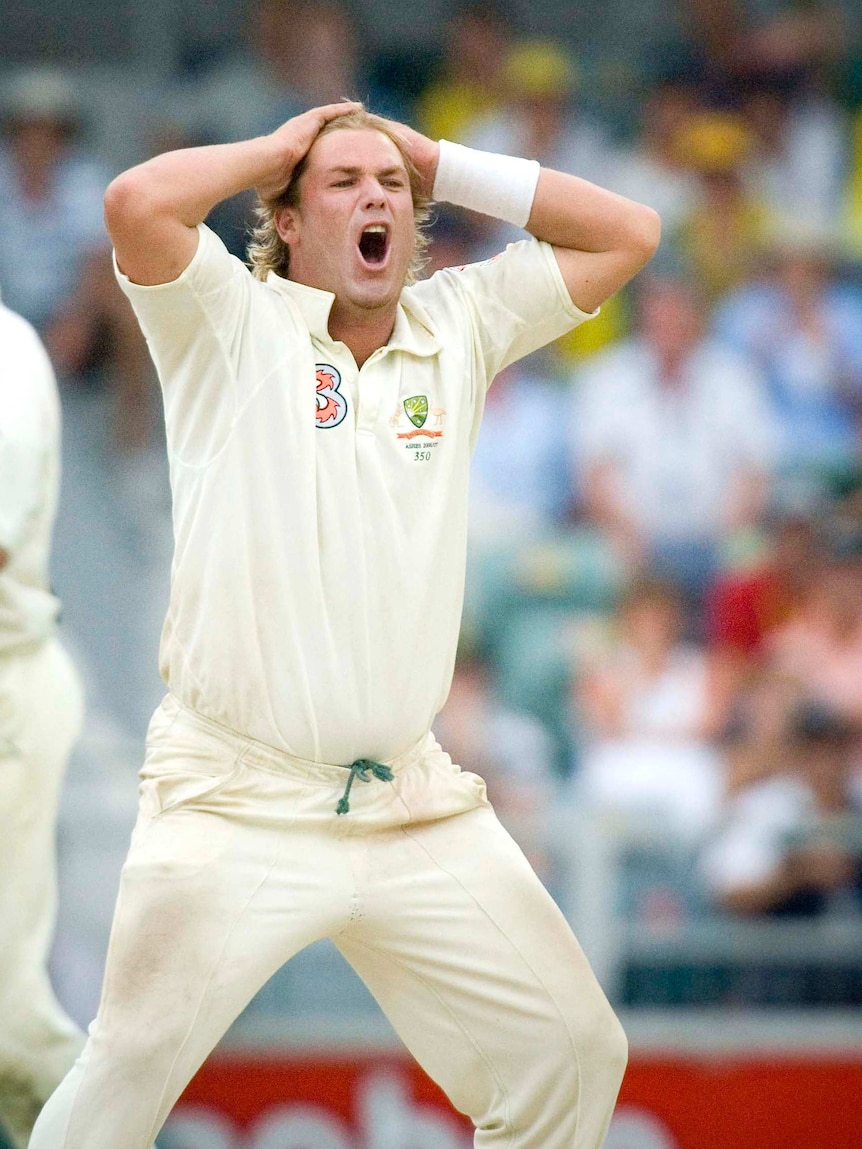 Shane Warne expresses disbelief after narrowly failing to claim a wicket.