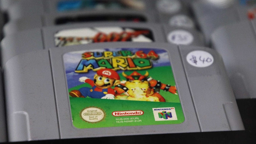 A collection of Nintendo 64 game cartridges including Super Mario 64 and Goldeneye