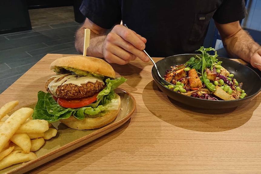 A vegan burger and vegan rice bowl