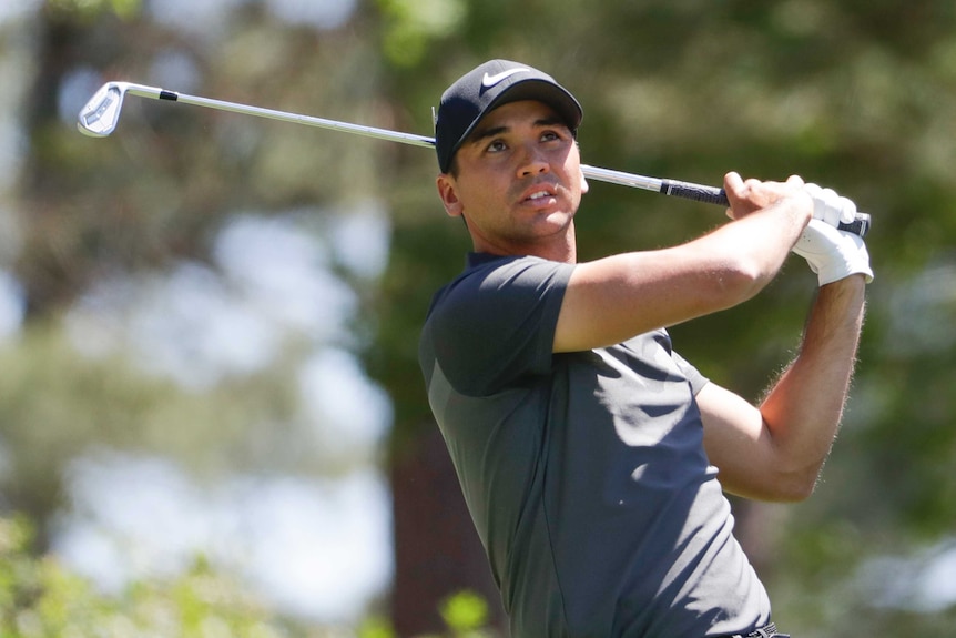 Jason Day hits a tee shot on the fourth hole at Augusta National.