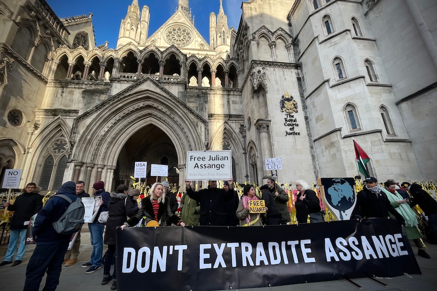 Supporters of Julian Assange protest outside the Royal Courts of Justice in London