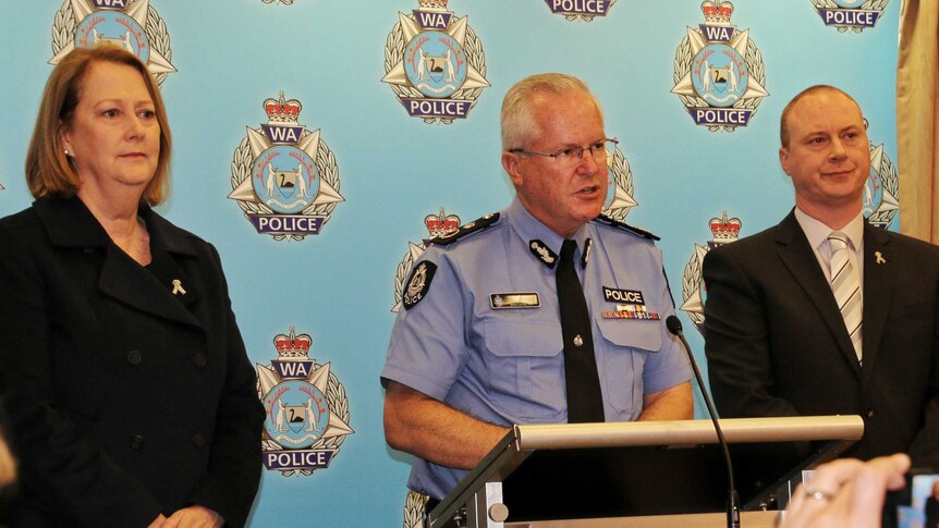 Michelle Roberts, Chris Dawson and George Tilbury at a press conference at police headquarters.