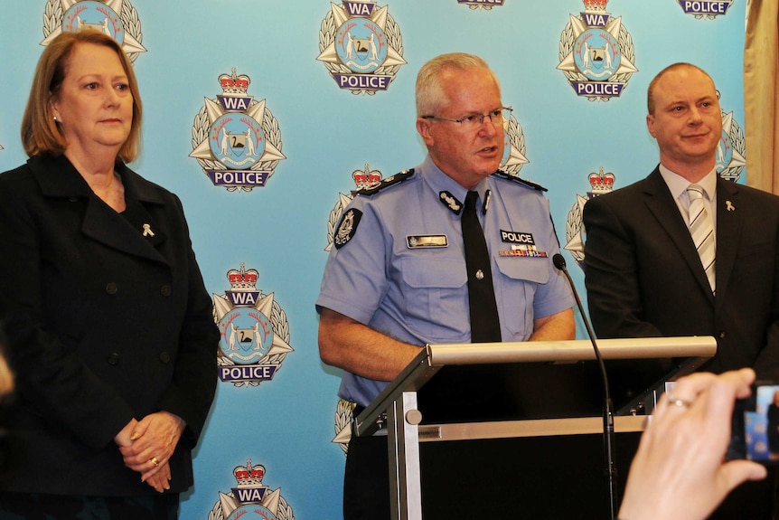 Michelle Roberts, Chris Dawson and George Tilbury at a press conference at police headquarters.