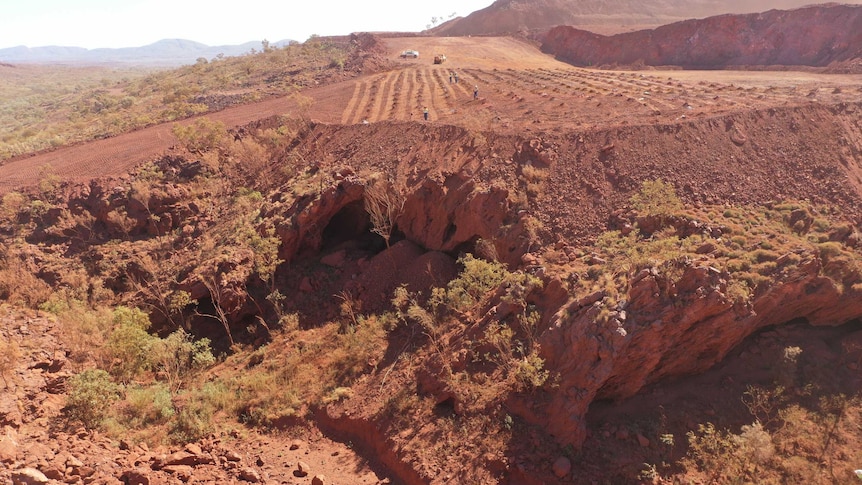 An aerial view of the red dirt and trees of the Juukan Gorge.