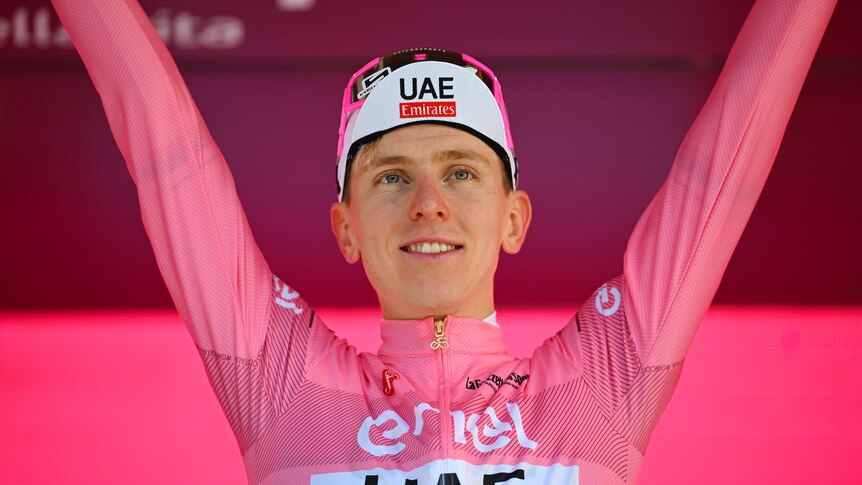 Tadej Pogačar raises his arms after the seventh stage of the Giro d'Italia.