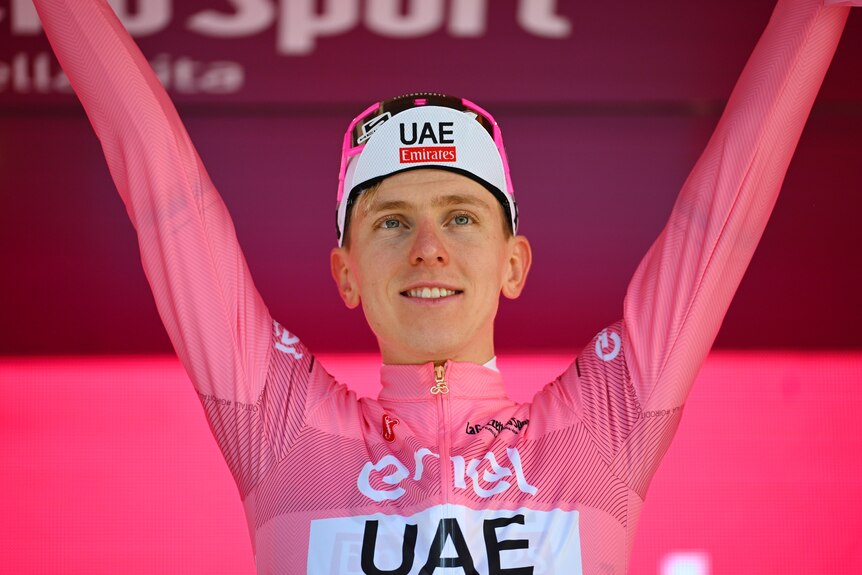 Tadej Pogačar raises his arms after the seventh stage of the Giro d'Italia.
